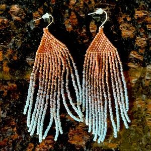 Hand beaded fringe earrings.